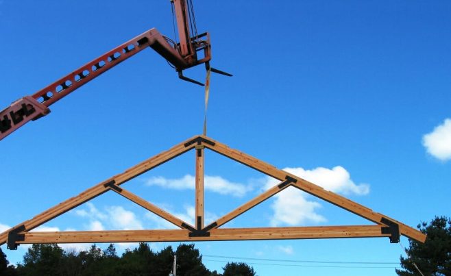 Crane Lifting a Timber Truss